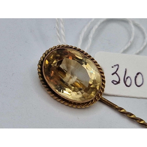 360 - A large Victorian high carat gold frame citrine set stick pin with yellow metal pin