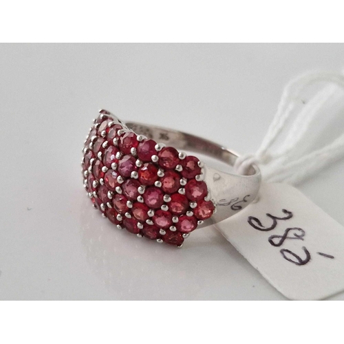 385 - A fancy white gold ruby set ring, 9ct, size M, 4.6 g.