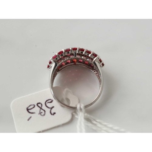 385 - A fancy white gold ruby set ring, 9ct, size M, 4.6 g.