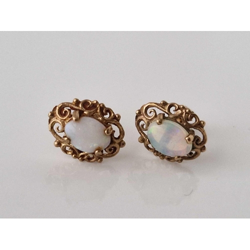 388 - A pair of opal ear studs, 9ct, 1.2 g.