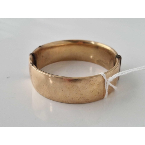 417 - A wide rolled gold bangle