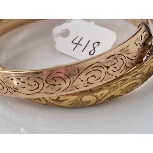 418 - Two rolled gold bangles