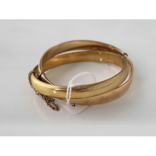 418 - Two rolled gold bangles