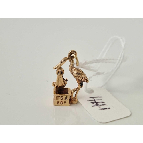 441 - A unusual stork baby articulated charm, 9ct, 2.9 g.