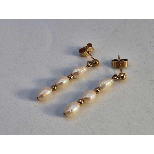 451 - A pair of gold three pearl drop earrings, 9ct