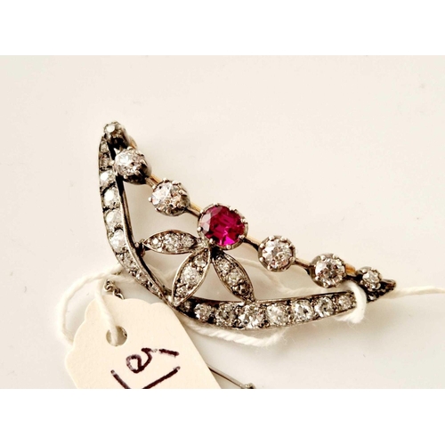 51 - A EARLY VICTORIAN GOLD RUBY AND DIAMOND BROOCH WITH SILVER SET OLD CUT AND CUSHION CUT DIAMONDS, app... 