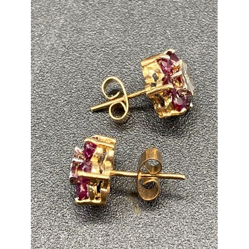 514 - A pair of ruby and diamond cluster earrings