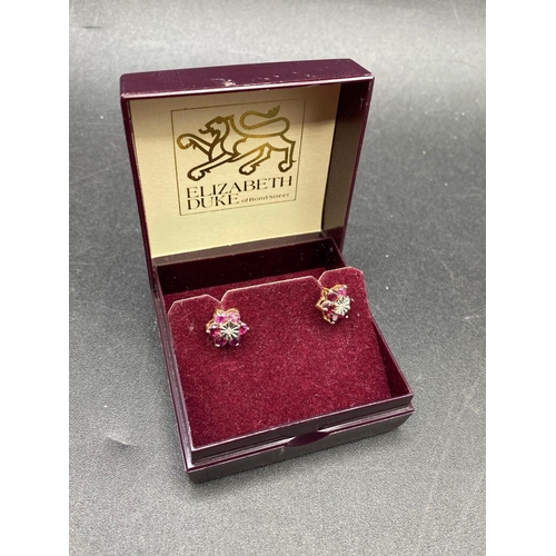 514 - A pair of ruby and diamond cluster earrings