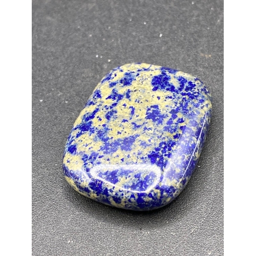 518 - A lapis gem stone paper weight 140 carats