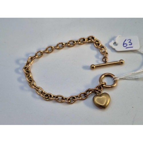 63 - A nice 9ct T bar bracelet with 9ct charm 8.1g