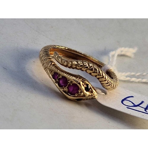 64 - A vintage snake ring set with rubies and sapphires 9ct size P 4.4g