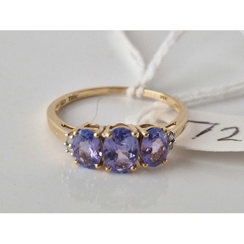 72 - A three stone tanzanite ring with diamond shoulders 10ct gold size S 1.9 gms