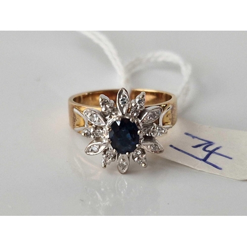 74 - A DIAMOND AND SAPPHIRE FLORAL DESIGN RING 18CT GOLD WITH GOOD CENTRAL SAPPHIRE AND 18 DIAMONDS SIZE ... 