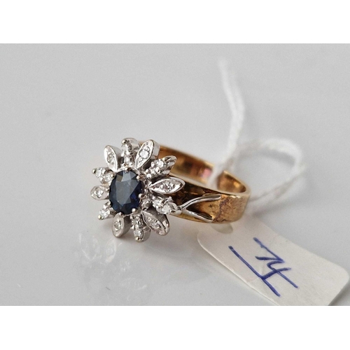 74 - A DIAMOND AND SAPPHIRE FLORAL DESIGN RING 18CT GOLD WITH GOOD CENTRAL SAPPHIRE AND 18 DIAMONDS SIZE ... 