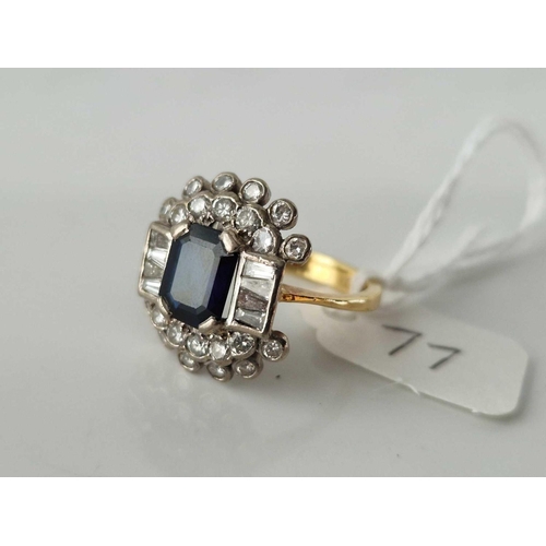 77 - A LARGE SAPPHIRE AND BAGUETTE DIAMOND RING 18CT GOLD SIZE Q 5.4 GMS