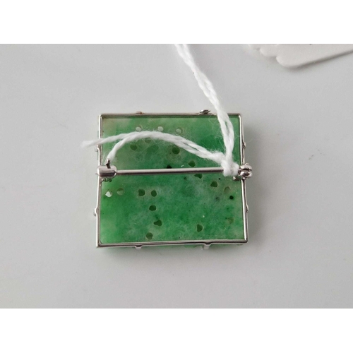 78 - A white gold and jade brooch 9ct