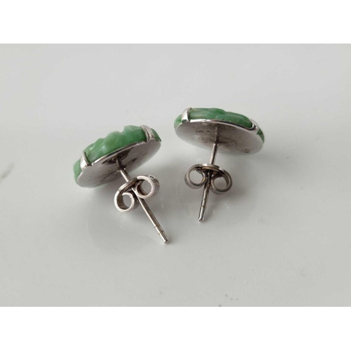 79 - A pair of white gold and jade earrings 18ct gold