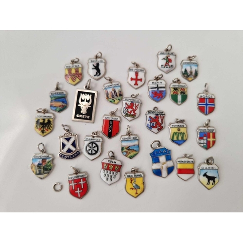 92 - A quantity of silver and enamel medallion charms, 33 g