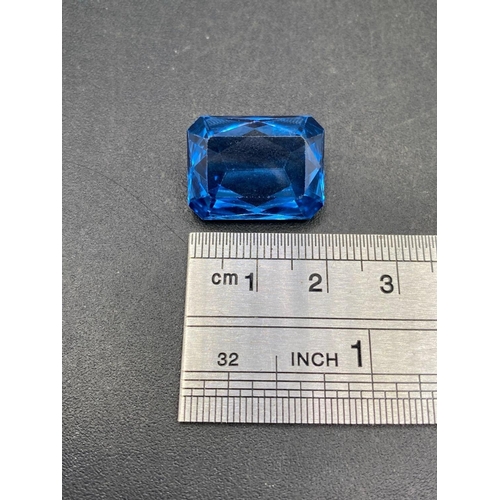 116 - A good deep blue Brazilian topaz special trapeze cut 22 carats