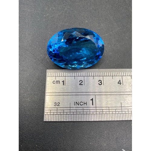 120 - A fine Brazilian intense blue topaz gem stone 29.5 X 20.6 X 13.6 65 carats