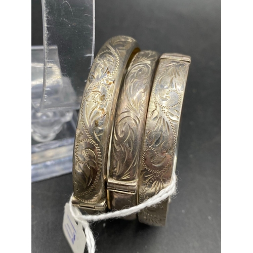 177 - Three silver floral bangles 46g