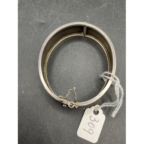 309 - A wide silver floral bangle