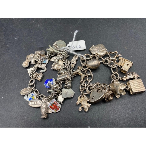 366 - Two antique silver charm bracelets 107g