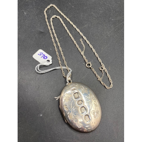 370 - A large heavy gauge silver jubilee oval locket and chain