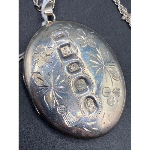 370 - A large heavy gauge silver jubilee oval locket and chain