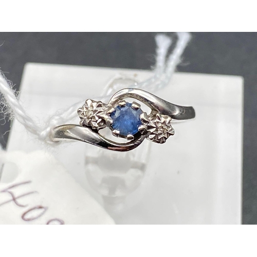 408 - A white gold diamond and sapphire three stone ring 9ct size P