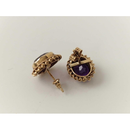 103 - A pair of amethyst earrings approx 1.5 carats each stone 9ct 2.4 gms