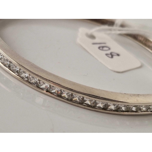 108 - A silver stone set hinged set bangle