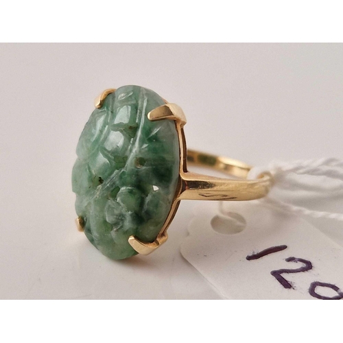 129 - A gold oval carved jade ring 14ct gold size N 4.5 gms