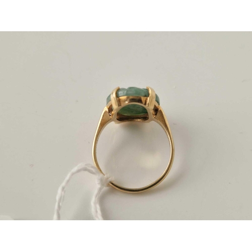 129 - A gold oval carved jade ring 14ct gold size N 4.5 gms