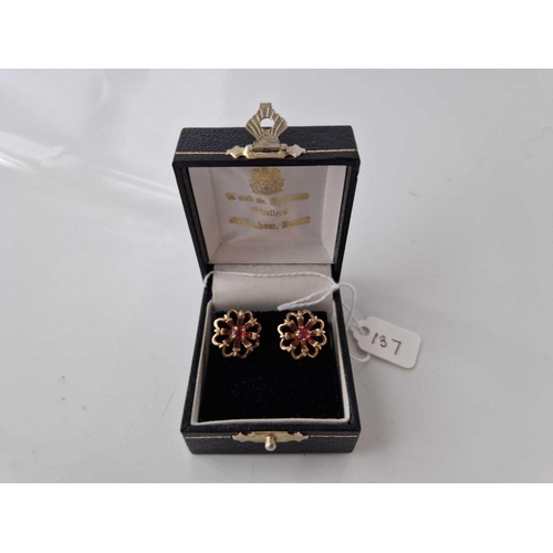 137 - A pair of boxed garnet ear studs 9ct 2.9 gms