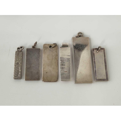 153 - Five silver ingot pendants and one other 81.6 gms