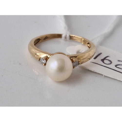 162 - A pearl and diamond three stone ring, 10ct, 2 g