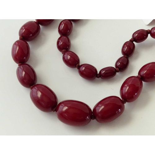 191 - A row of cherry red beads