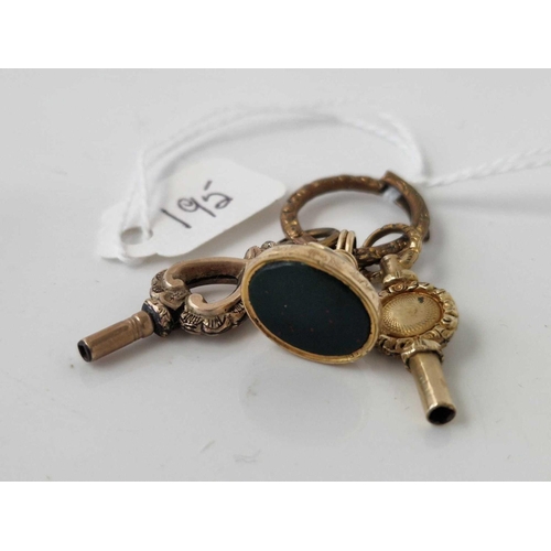 195 - Two watch keys and fob seal on a split ring