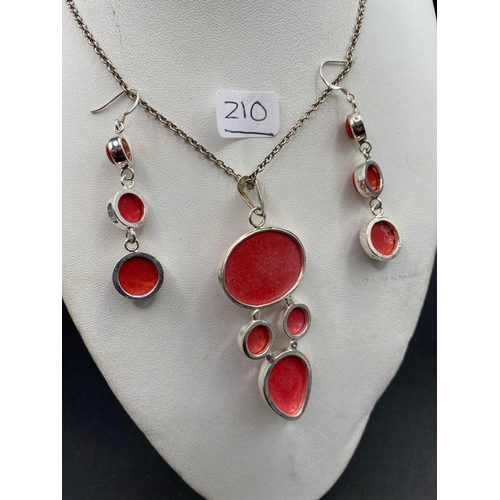 210 - A silver and red stone designer necklace and earrings