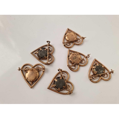 218 - A unusual set of six gilt heart shaped vintage portrait brooches