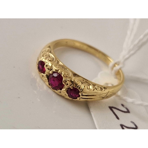 222 - A THREE STONE RUBY RING 8CT GOLD SIZE K