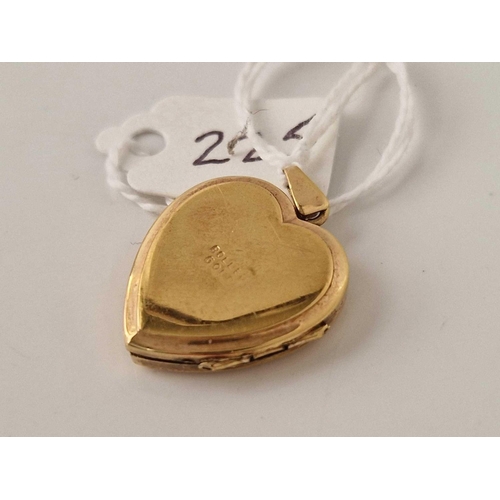 225 - A 9ct rolled gold heart shaped locket