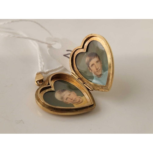 225 - A 9ct rolled gold heart shaped locket