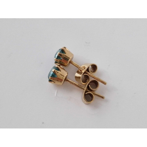 232 - A pair of topaz ear studs 9ct