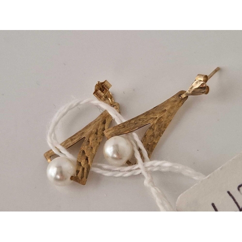 277 - A pair of gold and pearl ear pendants