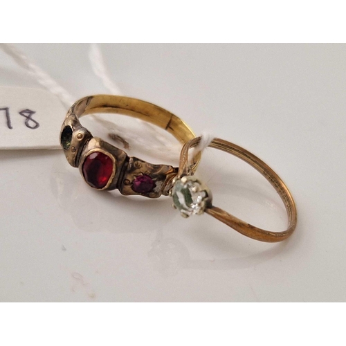 278 - A antique yellow metal red stone ring together with a rolled gold example