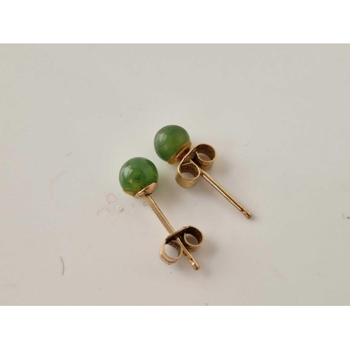 279 - A pair of 9ct gold jade studs