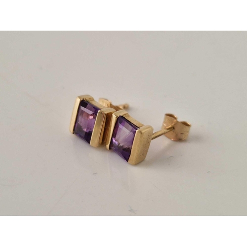 281 - A pair of square cut amethyst earrings 9ct