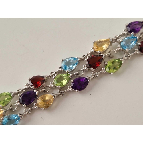 284 - A silver multi gem stone set bracelet 7.5 inch